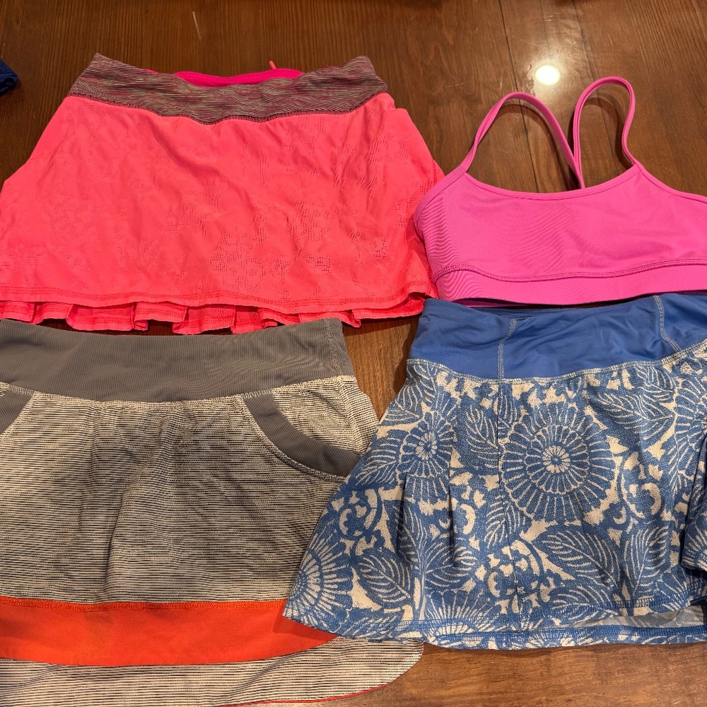 set of 3 Lululemon running skirts and one Lululemon jog top - all size 2